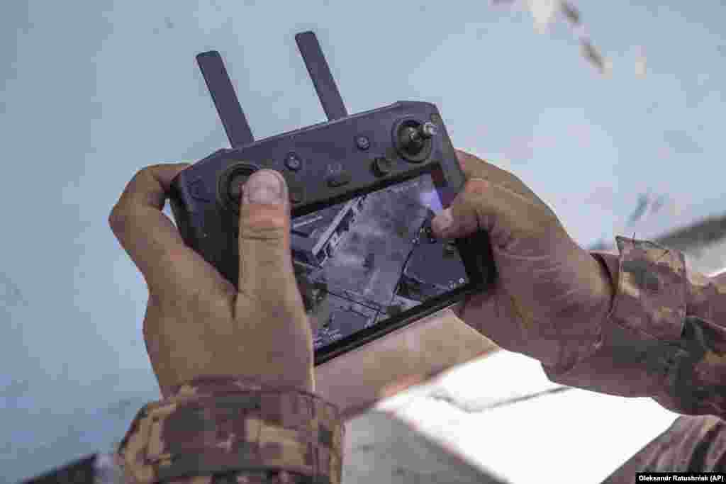 A Ukrainian serviceman looks at a drone screen showing Russian troop positions during heavy fighting at the front line in Syevyerodonetsk. Drones have proven to be especially useful to both sides in their fight for control of the strategic city.