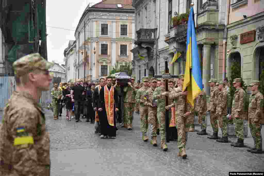 People gather in Lviv for the funeral of Senior Lieutenant Ruslan Skalskiy, who was killed on June 4 by Russian artillery shelling in the Mykolayiv region.