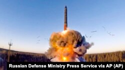 A rocket launches from a missile system as part of a ground-based intercontinental ballistic missile test launched from the Plesetsk facility in northwestern Russia in December 2020.