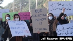 Afghan women attend a rally to mark International Women's Day in Herat on March 8.