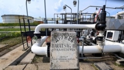 The receiver station of the Druzhba oil pipeline between Hungary and Russia with a memorial plate of its construction at the Duna (Danube) Refinery of Hungary's MOL near the town of Szazhalombatta, south of Budapest