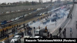 People protesting higher gas prices and government policies on a highway in Tehran, Iran November 16, 2019. 