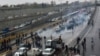 People protest against increased gas price, on a highway in Tehran, Iran November 16, 2019. 