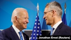 U.S. President Joe Biden (left) with NATO Secretary-General Jens Stoltenberg at the alliance's summit in Madrid on June 29. 