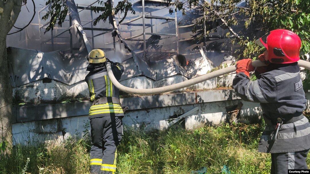 Firefighters extinguish a blaze at a logistics hub after a Russian missile strike on Odesa on June 20.
