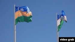 The flags of Uzbekistan (right) and Karakalpakstan (file photo)