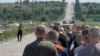 A view of the prisoner exchange on a road near Zaporizhzhya on June 29 in a photo provided by Ukraine's Military Intelligence.