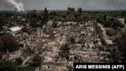 An aerial view shows destroyed houses after a Russian strike in the town of Pryvillya in the eastern Ukrainian region of Donbas on June 14.