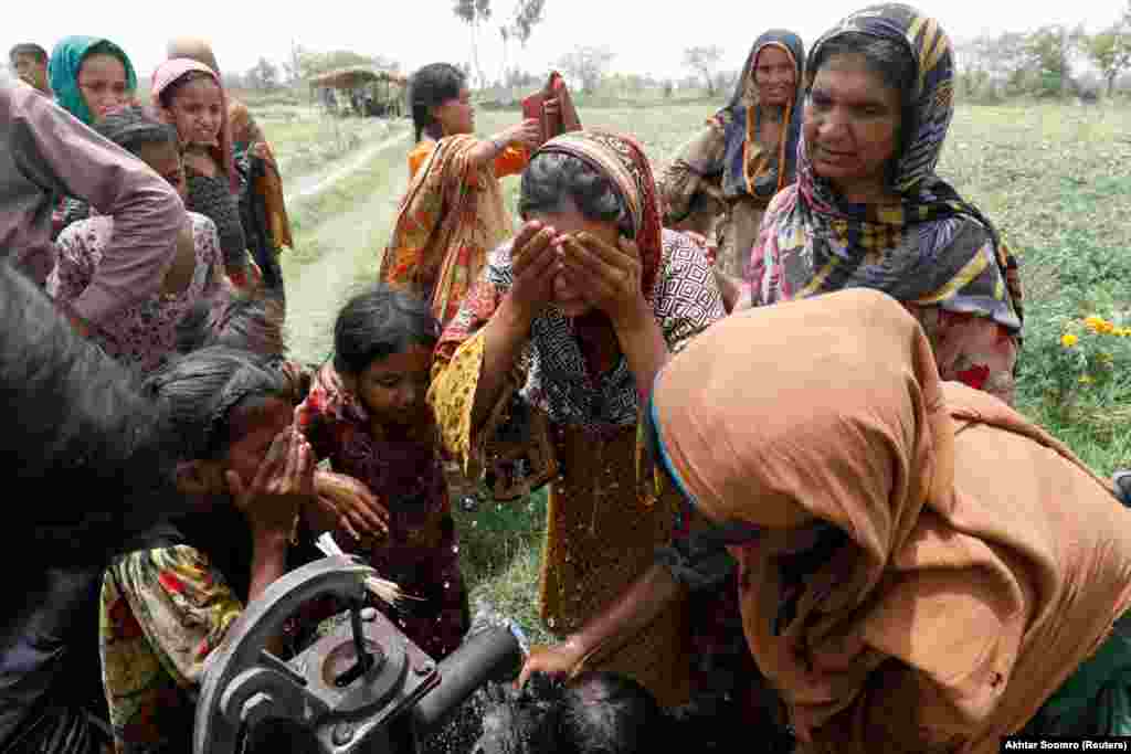 Women and children try to cool off with water while working on a farm near Jacobabad during a record-breaking heat wave.&nbsp;Meteorologists called the May 14 temperature of 51 degrees Celsius highly unusual.&nbsp;The average maximum daytime temperature in Jacobabad is usually around 43&nbsp;degrees, with a nighttime low of&nbsp;&nbsp;26 degrees.