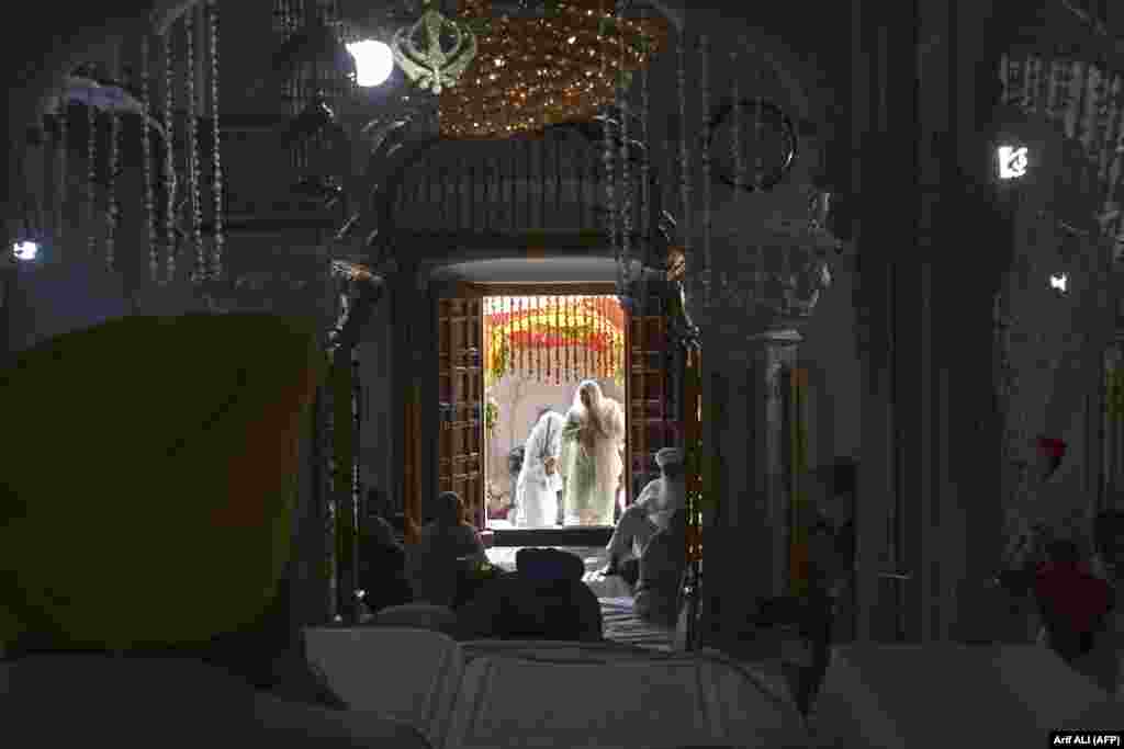 Sikh pilgrims gather to commemorate the 183th death anniversary of Ranjit Singh, the first maharaja of the Sikh empire, at Gurdwara Dera Sahib in Lahore on June 29.