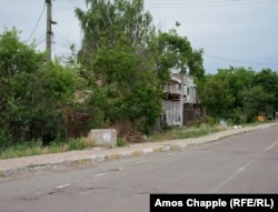 June 23. A poster has been placed on the concrete block advertising heavy rubbish removal.