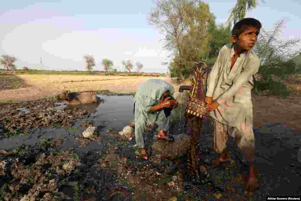 Young boys try to cool down during the heat wave as a water buffalo sits in the mud behind them. Nearly 90 percent of Pakistan&#39;s agriculture is supported by irrigation from the glacier-fed River Indus and its tributaries. Climate change has accelerated glacier melt, increasing the likelihood of glacier-lake-outburst floods and flash floods downstream, according to the OCHA. Rapid glacier melt, rising temperatures, shifting seasons, and erratic rainfall patterns are all altering the flow of the Indus, which will have an increasing impact on agricultural activities, food production, and livelihoods.