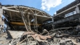 Disassembly of the debris of the Amstor shopping center in Kremenchug, destroyed by the Russian rocket