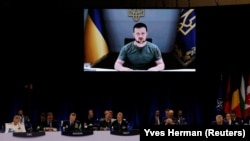 Ukrainian President Volodymyr Zelenskiy address NATO leaders via a video link on June 29.