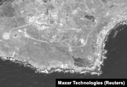 A satellite image shows the southern end of Snake Island and a destroyed tower (lower right), in a satellite image taken on June 21.