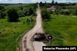 A ruined tank on the outskirts of Kyiv on June 14.