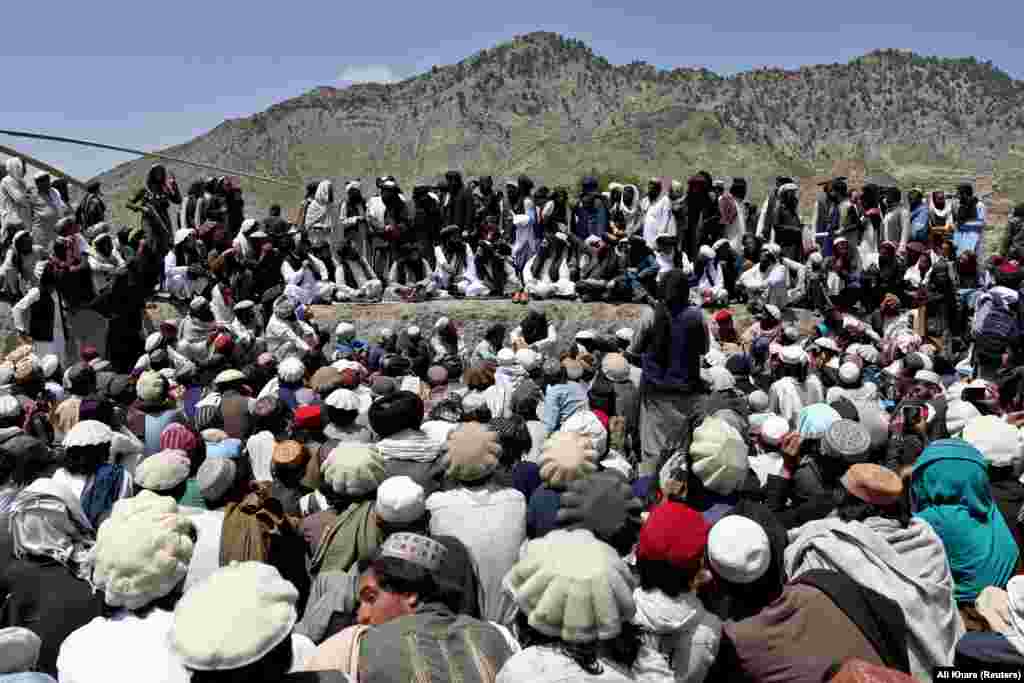 People wait to receive aid in Gayan, which was devastated by the June 22 earthquake.&nbsp;The quake was the deadliest in the country since 2002, when a similarly powerful tremor killed about 1,000 people in northern Afghanistan.