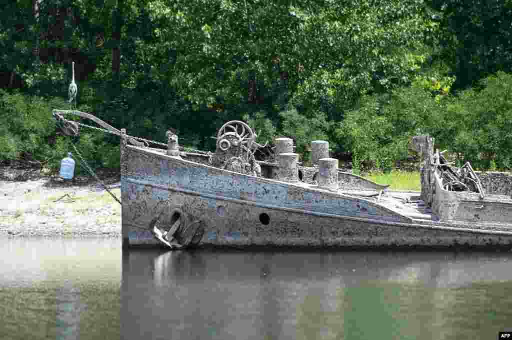 Photos from northern Italy, where water is being rationed, show dramatic results of the drought. This June 15 photo shows a barge that was sunk by an American bomb during World War II on Italy&#39;s Po River. The vessel reemerged from its watery grave as a result of extremely low water levels.&nbsp;