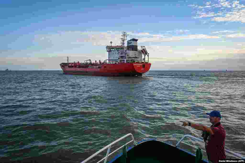 A Romanian pilot boat crewman is seen in front of a ship preparing to enter the Sulina Canal.&nbsp; A director of a Romanian port operations company told Al-Jazeera that &quot;Considering the large grain volumes that are in need of export from Ukraine, I believe this has to be a conjugated effort of all the European operators that have the capacity to participate.&quot; He added, &quot;There is no place for ego here.&quot;