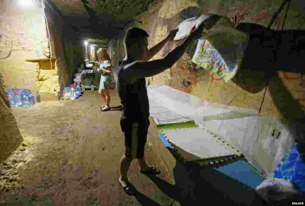 Volunteers are looking for more Soviet-era bomb shelters in Odesa&#39;s catacombs so that more people can seek safety there. Many of the shelters that have been discovered have been destroyed or stripped of materials such as air ducts, shower stalls, and piping, rendering them useless.