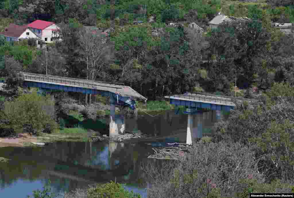 A view of the destroyed bridge linking Syevyerodonetsk with Lysychansk. All three bridges linking the two cities across the&nbsp;Siverskiy Donets River were destroyed.