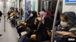 Women ride the subway in the northern Iranian city of Mashhad.