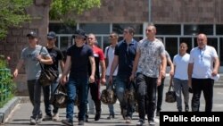 Armenia - Young men drafted for compulsory military service are seen at a recruitment center in Yerevan, June 28, 2022.