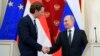 Russian President Vladimir Putin (right) and Austrian Chancellor Sebastian Kurz shake hands after a joint news conference following their talks in Moscow in February.