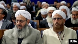 Molavi AbdolHamid Ismaeelzahi (L), a Sunni theologian and a spiritual leader of the Sunni community in Iran, in a meeting of Sunni clerics with president Hassan Rouhani, on December 11, 2016.