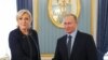 Marine Le Pen, leader of the far-right French National Rally party, meets with Russian President Vladimir Putin in Moscow in March 2017. 