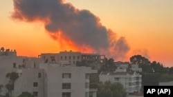 Smoke rises from Israeli air strikes in Beirut on September 27.