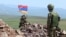 An Armenian soldier stands watch on the frontier.
