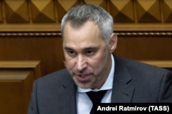 Then-Ukrainian Prosecutor-General Ruslan Ryaboshapka speaks to lawmakers during an extraordinary session of the Ukrainian parliament in Kyiv to consider his dismissal on March 5, 2020.