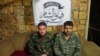 تصویر دو نفری که «گردان شام» می‌گوید نظامی ایرانی هستند و یکشنبه شب آنها را اسیر کرده است.