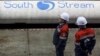 Russia -- Employees stand near pipes made for the South Stream pipeline at the OMK metal works in Vyksa in the Nizhny Novgorod region, April 15, 2014