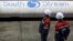 Russia -- Employees stand near pipes made for the South Stream pipeline at the OMK metal works in Vyksa in the Nizhny Novgorod region, April 15, 2014