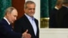 Russia - Russian President Vladimir Putin gestures next to Iranian President Masoud Pezeshkian as they attend a signing ceremony at the Kremlin in Moscow, January 17, 2025. 