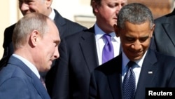 Президент России Владимир Путин (слева) и президент США Бара Обама (справа) на саммите "Большой двадцатки". Санкт-Петербург, 6 сентября 2013 года.
