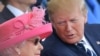 U.S. President Donald Trump (R) talks to British Queen Elizabeth II during an event to commemorate the 75th anniversary of the D-Day landings, in Portsmouth, southern England, June 5, 2019