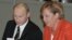 Putin (left) with German Chancellor Angela Merkel in Lahti on October 20