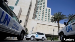 UN vehicles carrying OPCW inspectors are shown in Damascus in April.