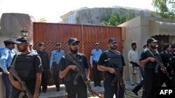 Police commandos guard a UN office in the wake of the suicide blast on October 5.