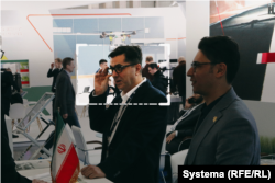 Arash Dorudi (highlighted) is seen visiting an aerospace exhibition in the Moscow region in February.
