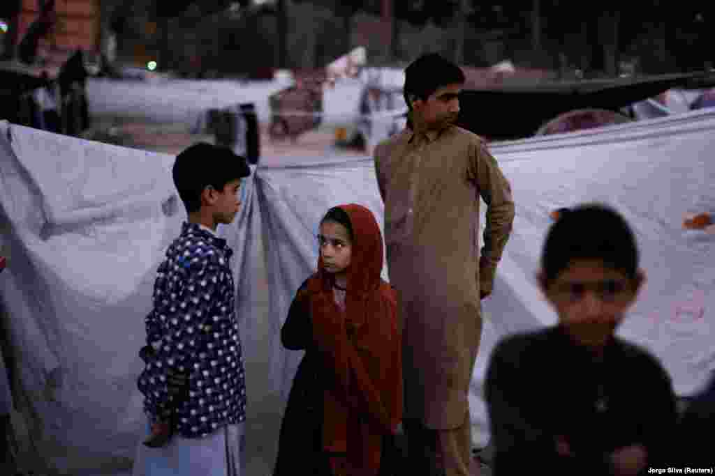 Internally displaced people are seen outside their makeshift shelters in a park in Kabul, Afghanistan October 3, 2021.&nbsp;