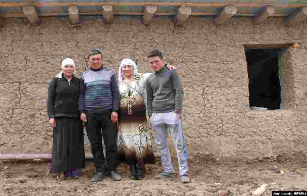 Avaz with his daughter, wife, and youngest son in front of the unfinished house. His oldest son studies English in Kyrgyzstan. The introduction of obligatory paperwork in the Tajik language made Avaz feel alienated as a veterinarian, so he is planning to move to Kyrgyzstan.