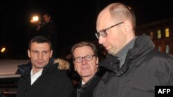 German Foreign Minister Guido Westerwelle, center, alongside Ukrainian opposition leaders Vitaliy Klitschko, left, and Arseniy Yatsenyuk.