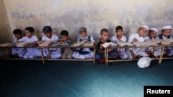 Afghan boys read the Koran at a madrasah in Kabul.