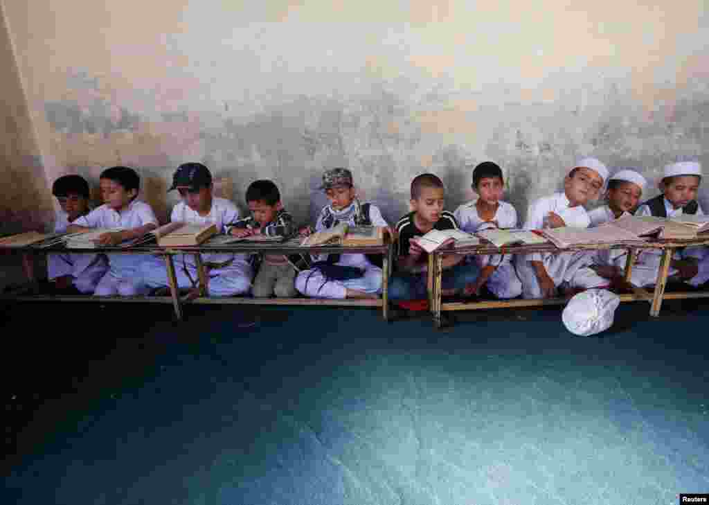 Afghan boys read the Koran in a madrasah, or religious school, during the Muslim holy month of Ramadan in Kabul. (Reuters/Omar Sobhani)