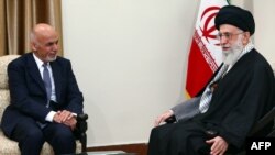 FILE: Iran's supreme leader Ayatollah Ali Khamenei with Afghan President Mohammad Ashraf Ghani in Tehran, April 2015.