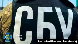 Ukraine’s Security Service (SBU) conducting a search in December (file photo)